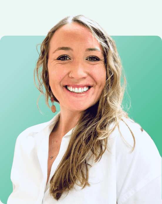 A woman with long wavy blonde hair smiles at the camera. She is wearing a white shirt, dangling earrings, and a nose ring. The background is a gradient of light teal and white with rounded corners.