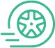 A simple green icon of a spinning car wheel with three motion lines to the left, suggesting movement or speed.