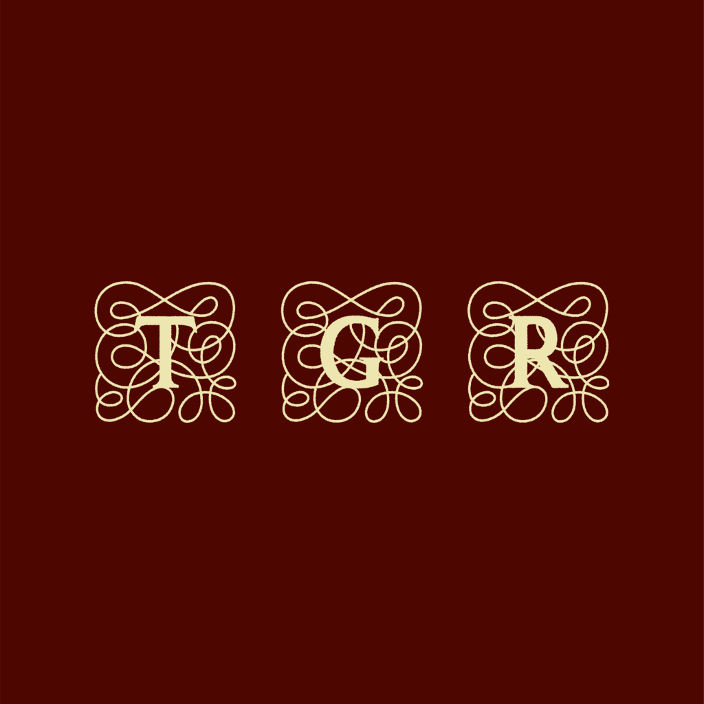Ornate gold letters T, G, and R, each surrounded by intricate decorative swirls, appear on a dark maroon background.